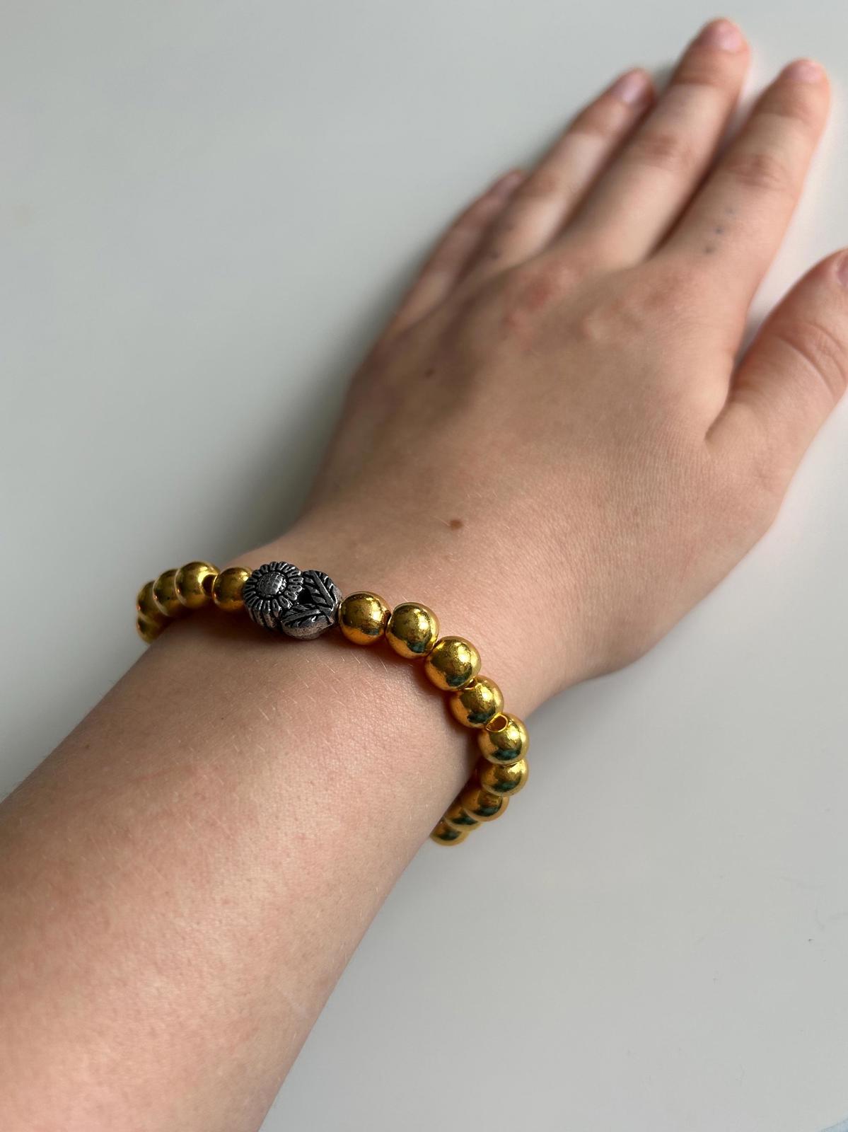 Gold Beaded Bracelet with Silver Sun Charm