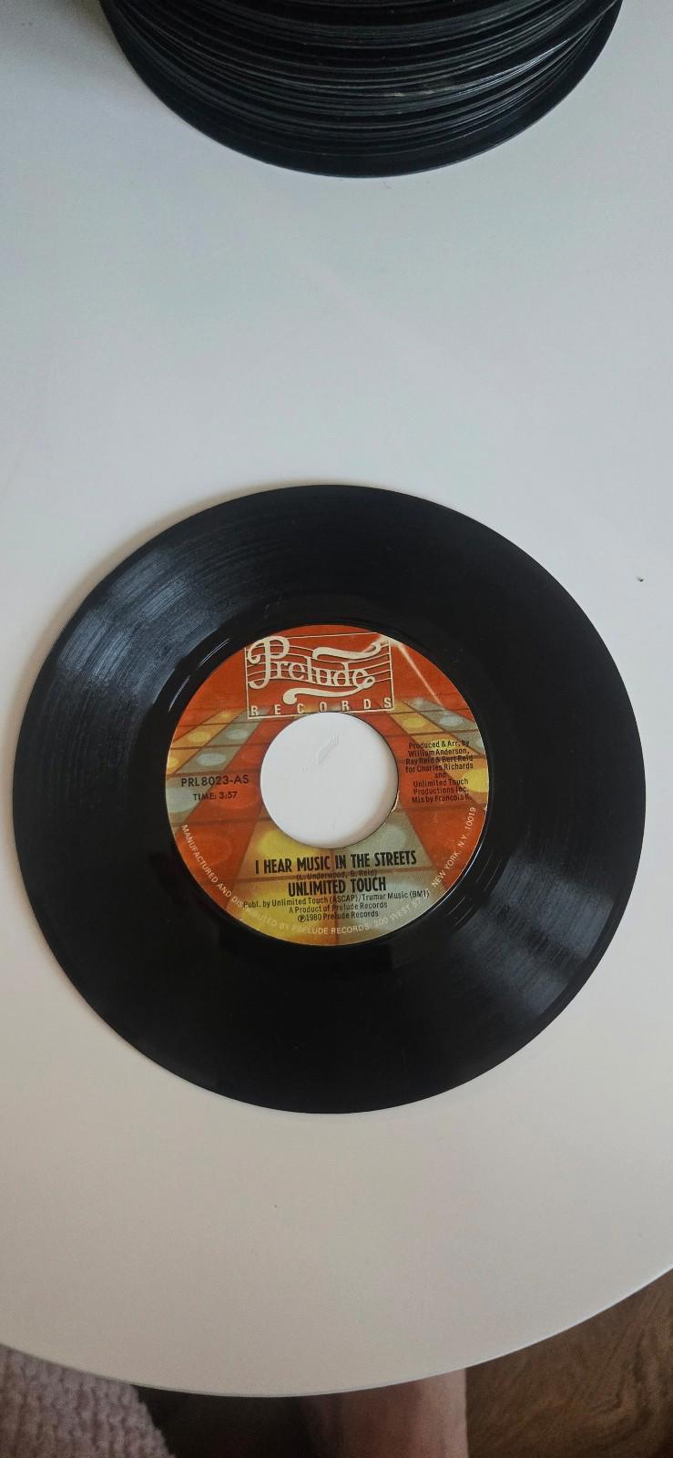 7-inch 45 RPM Vinyl "In The Middle""I Hear Music in the Streets" Unlimited Touch