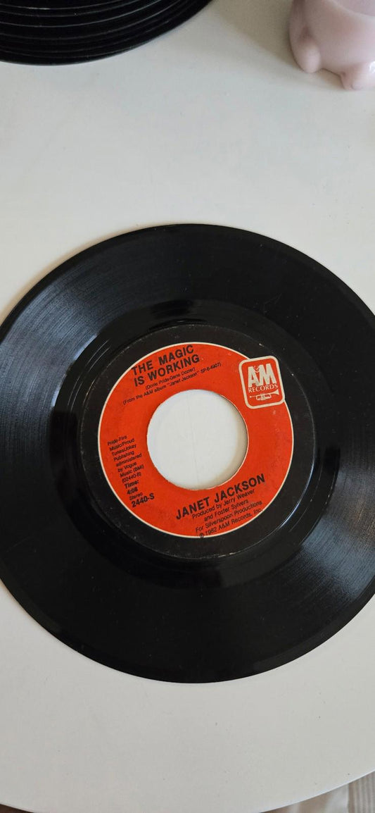 7-inch 45rpm vinyl single by janet jackson The Magic Is Working" & "Young Love"