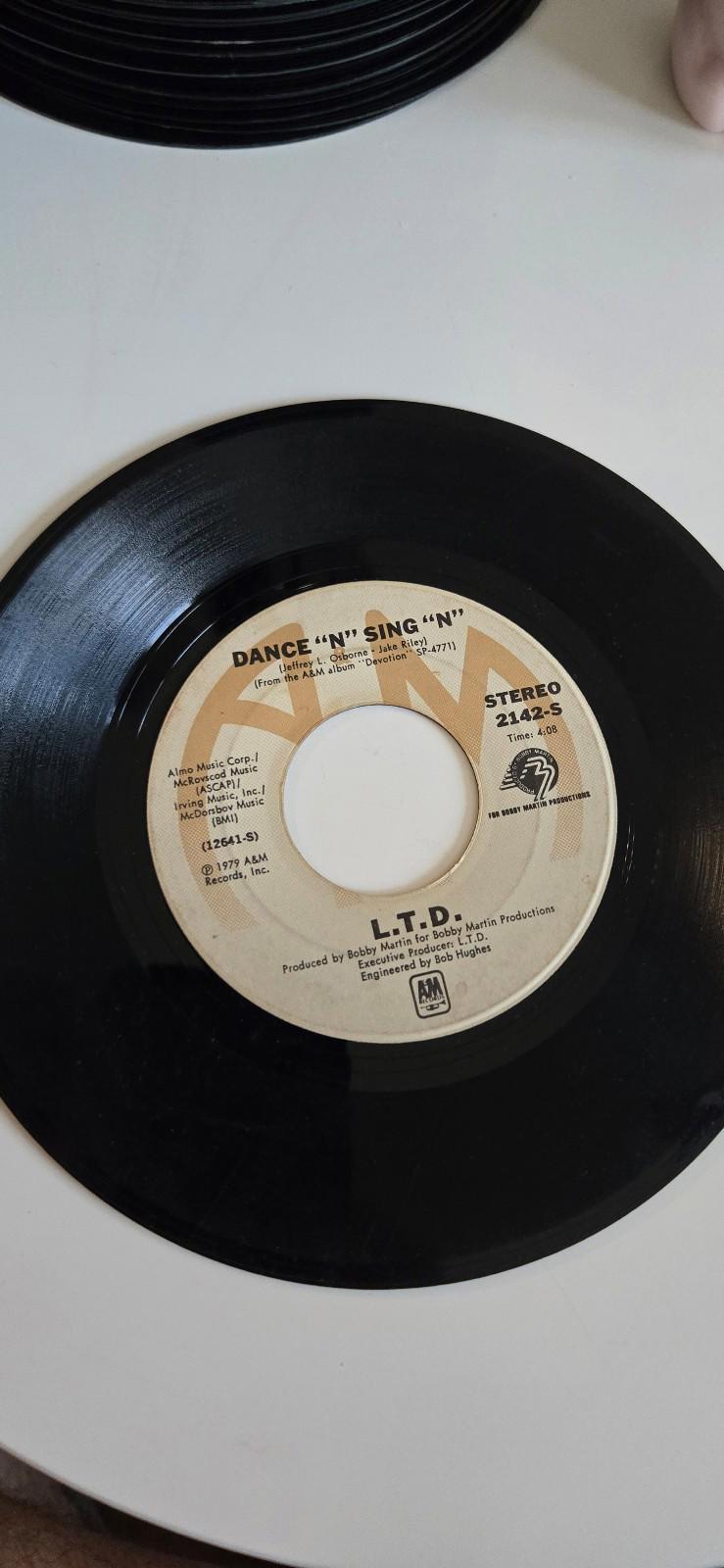 7-inch vinyl "Dance 'N' Sing 'N'", & "Give It All" by L.T.D.
