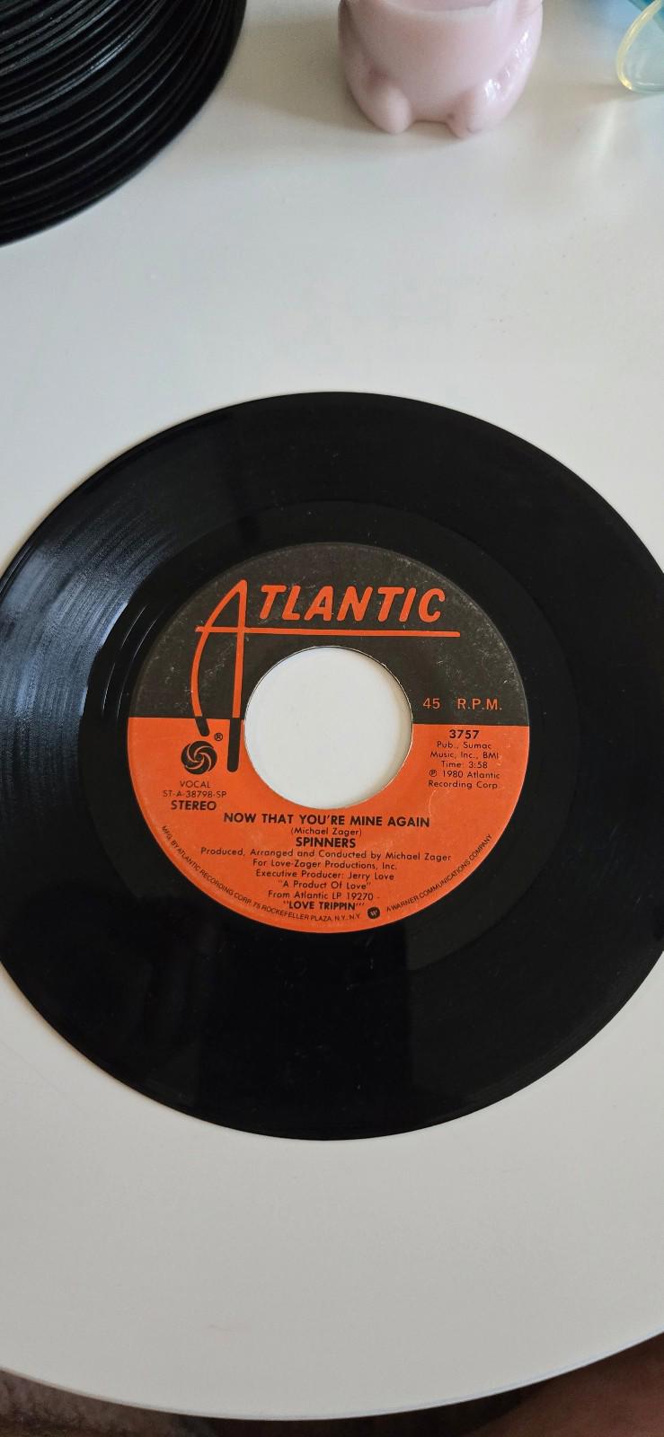 7-inch vinyl 45 by The Spinners "Now That You're Mine Again", "Love Trippin"