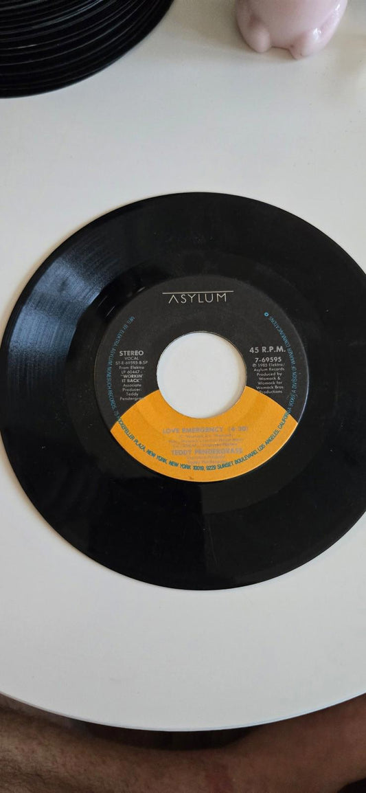 7-inch vinyl 45 RPM LPLove Emergency" and "Never Felt Like Dancin'". by Teddy