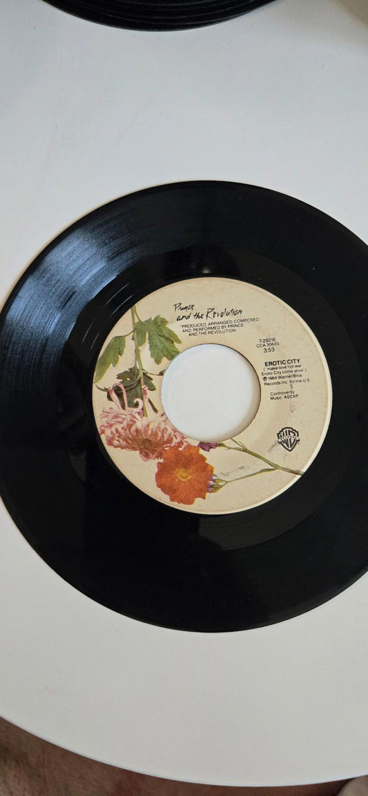 7-inch vinyl 45 RPM LP "Let's Go Crazy". "Erotic City" by Prince and The Revolut