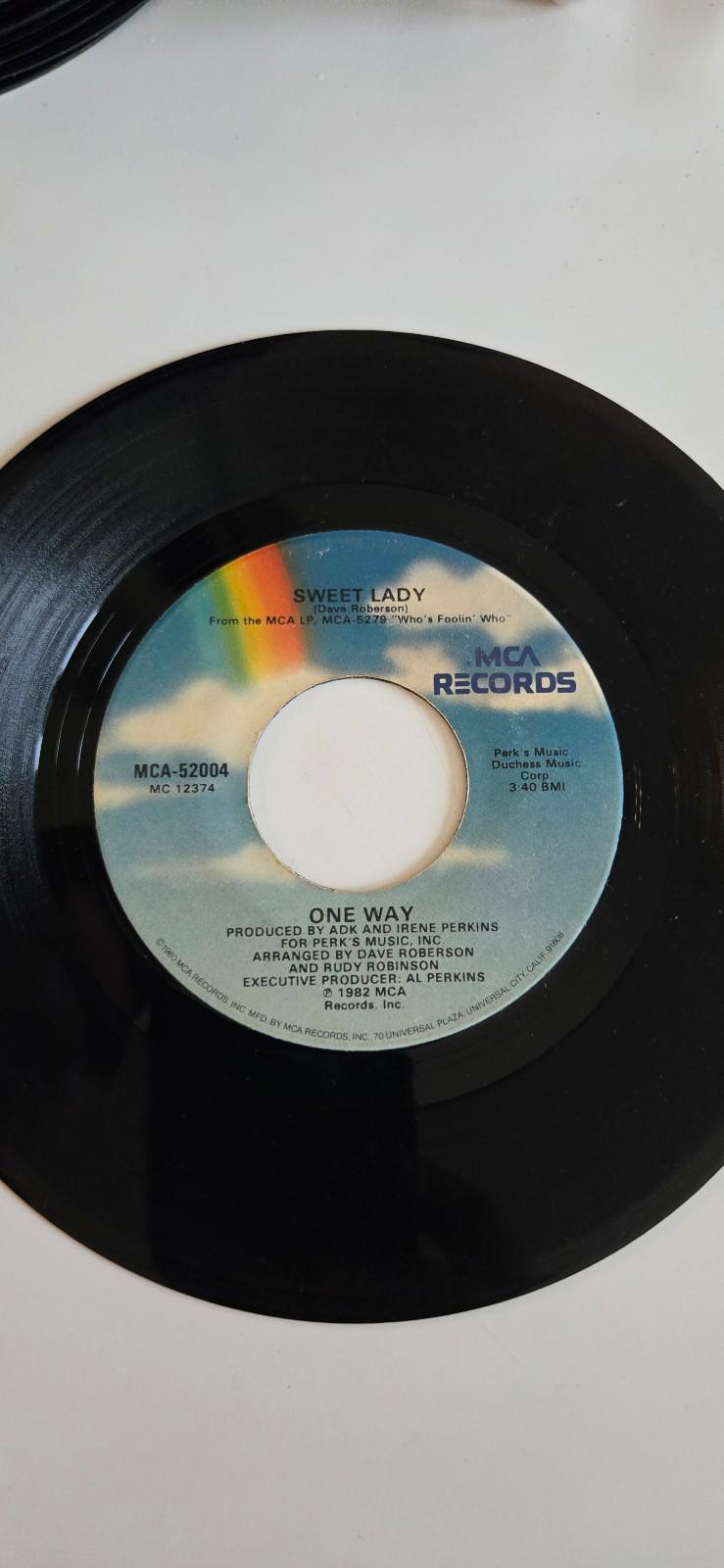 7-inch vinyl single by the group One Way Who's Foolin' Who, & "Sweet Lady" 1982
